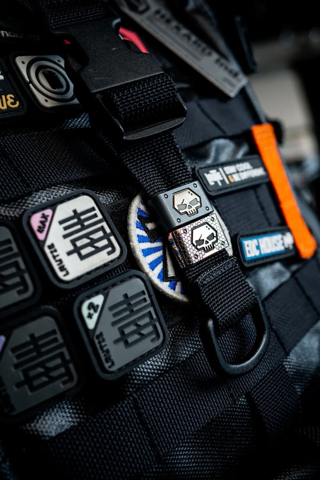 An LSP superconductor buckle on webbing, surrounded by black fittings and patches