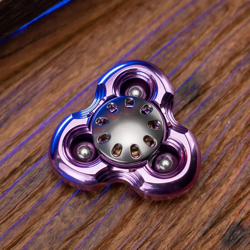 A purple three-arm Jilian with a gunmetal-coloured button